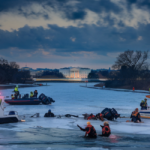 Rescue teams looking for wreckage and survivors in frozen Potomac River in Washington, D.C.